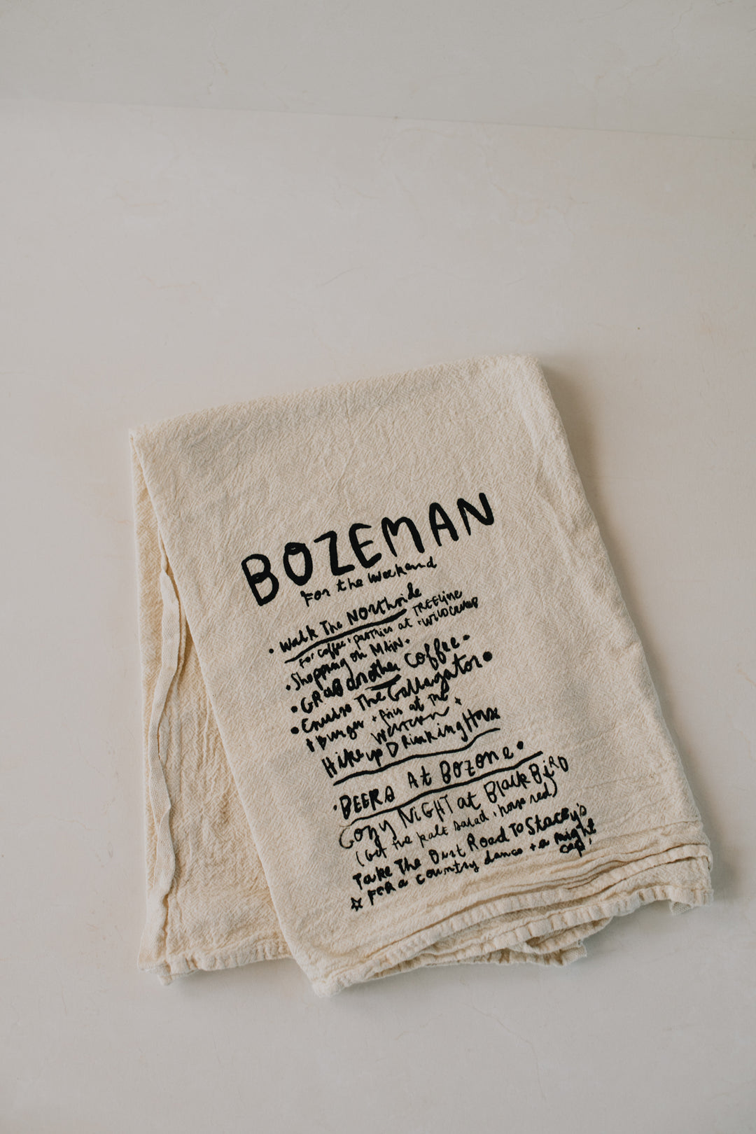 Intrigue Ink X Salchicha – Bozeman Day Dish Towel