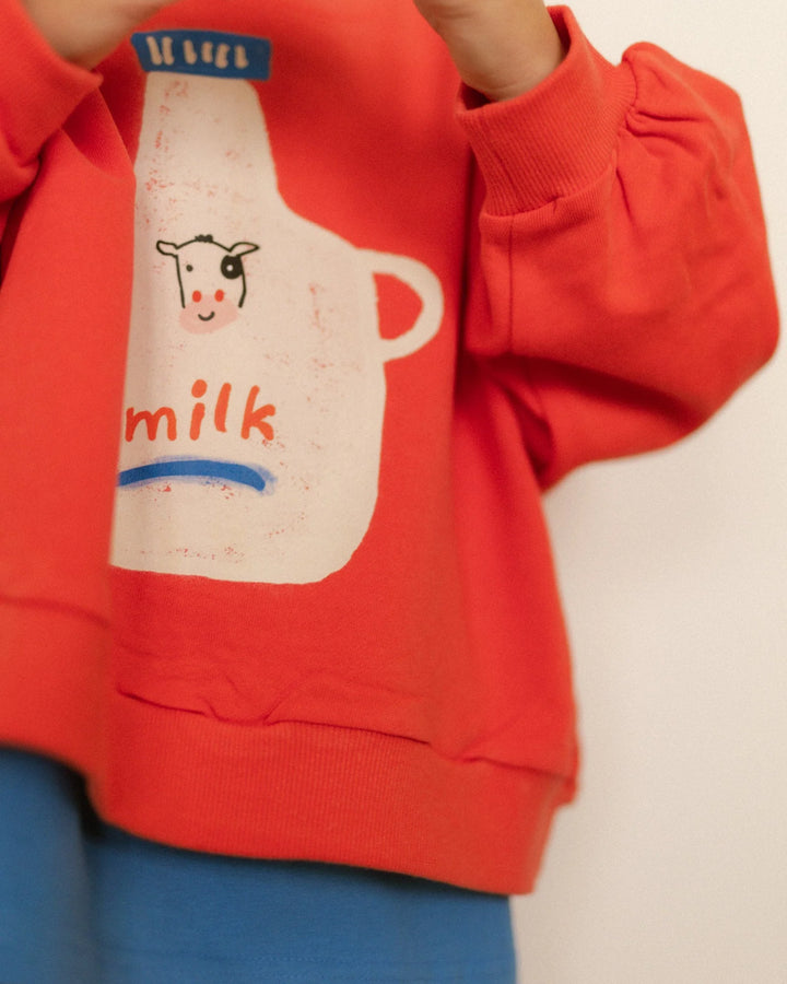 Pigeon Said Please – Milk Jug Sweatshirt in Magazine Stand Red